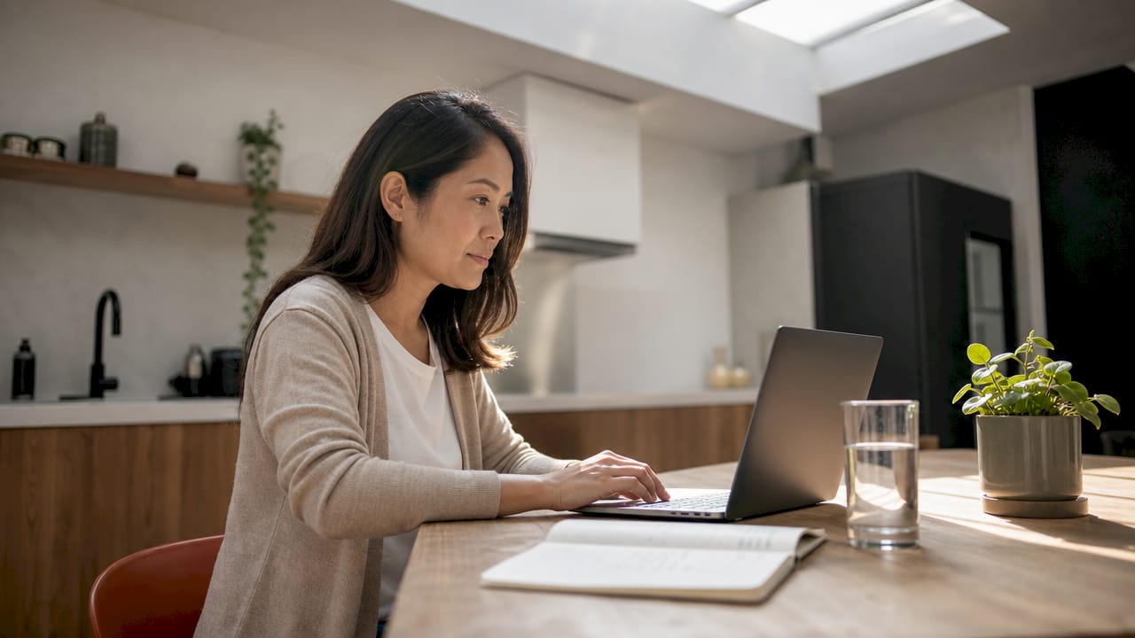 Person setting up Performance Max campaign on laptop