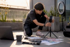 Hands setting up TikTok ad recording