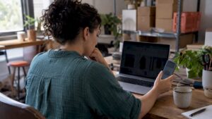 Founder comparing ecommerce storefront previews on devices